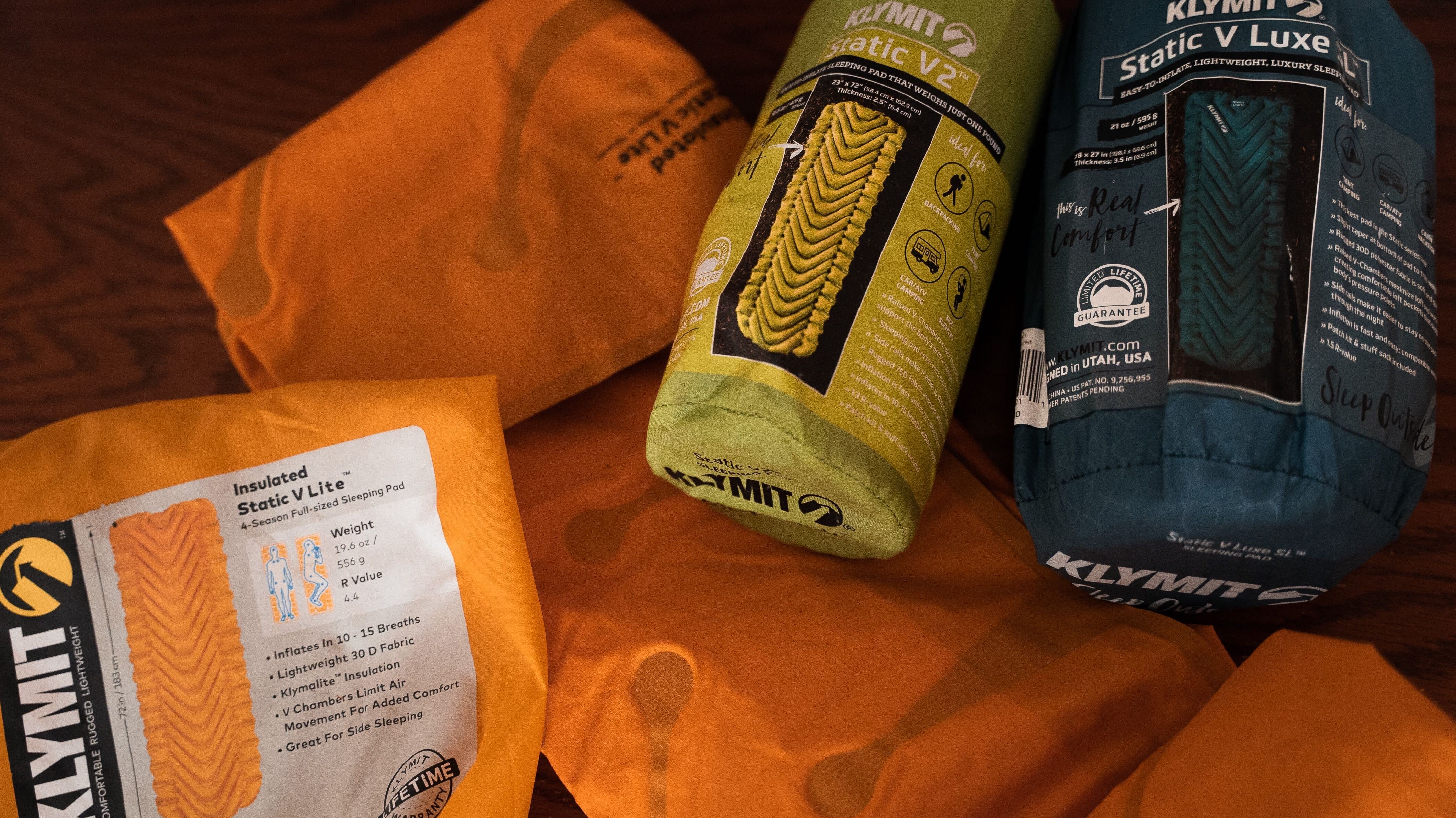 Several Klymit camping products being prepared for storage