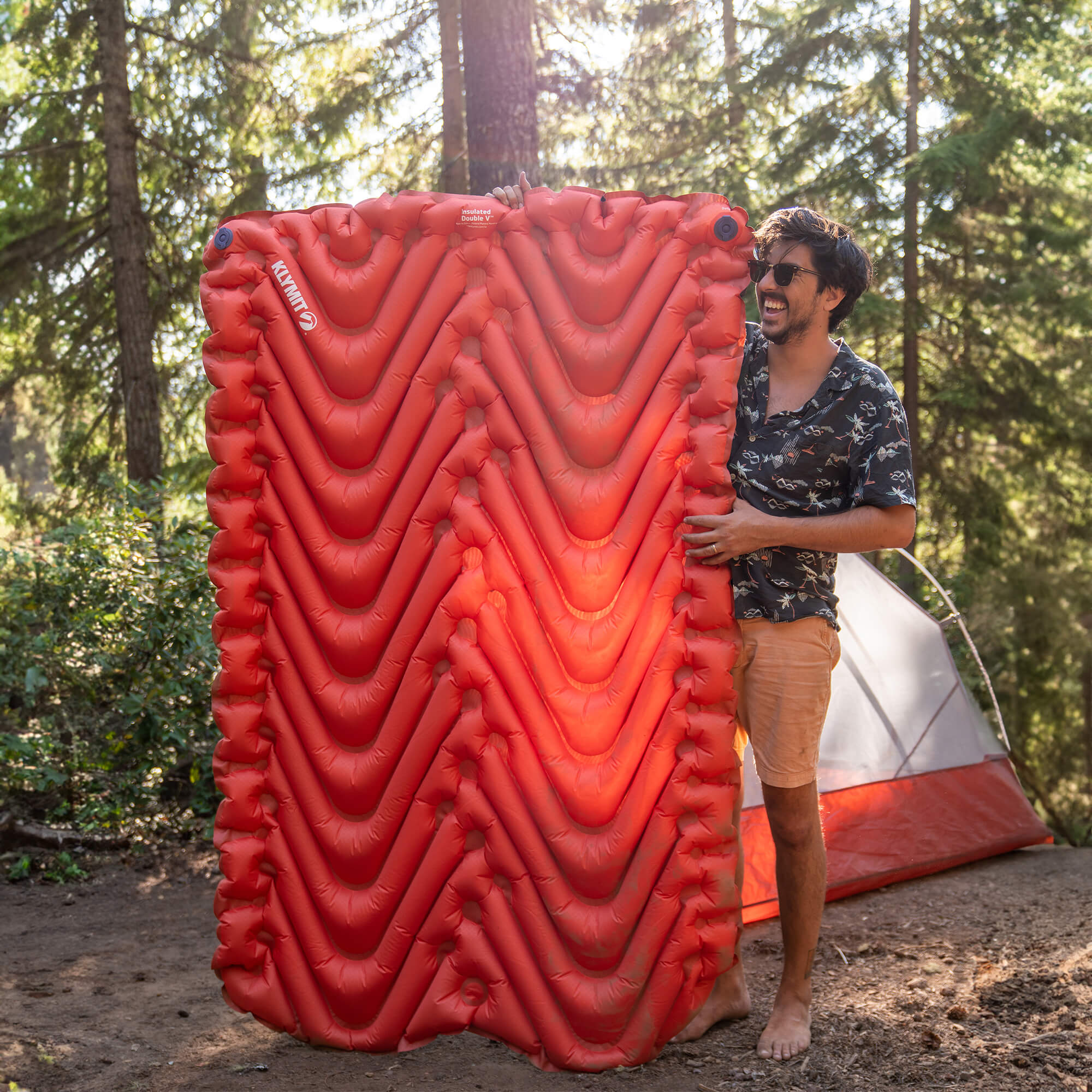 Insulated Double V Sleeping Pad, Orange, Lifestyle Man Standing with Pad