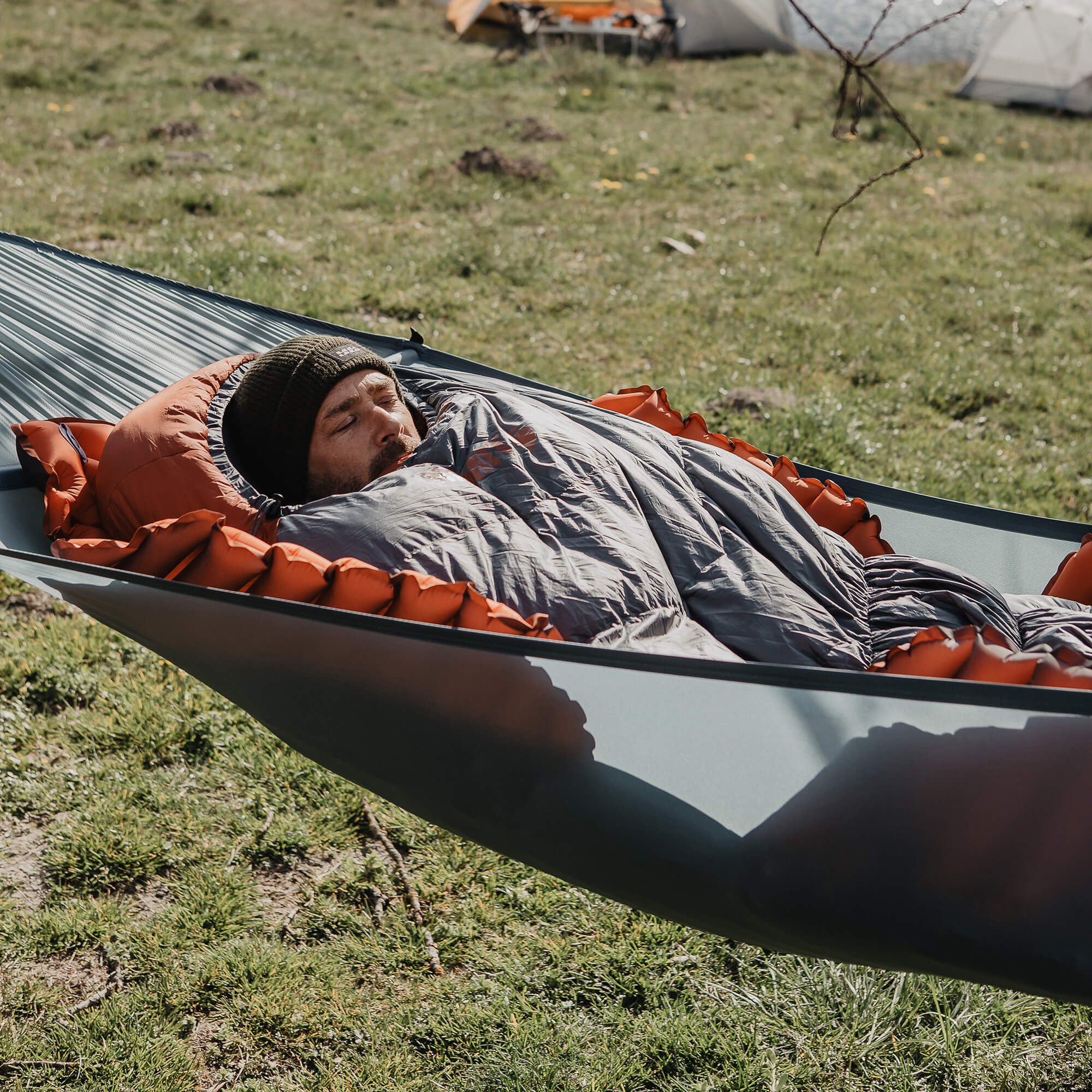Insulated Hammock V Sleeping Pad, Orange, Lifestyle Man Sleeping in Hammock