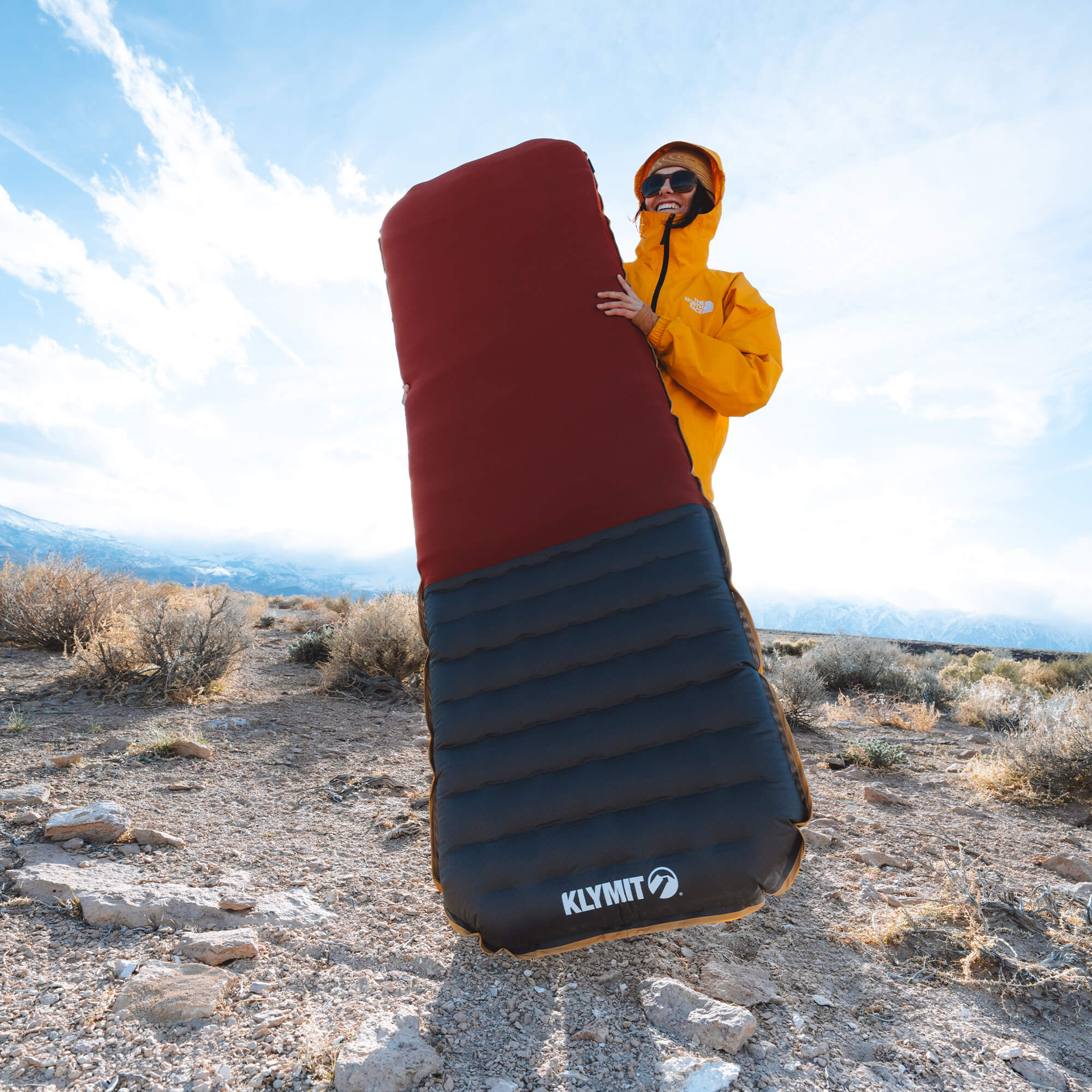 Insulated Klymaloft Sleeping Pad, Regular, Lifestyle Standing Holding Sleeping Pad