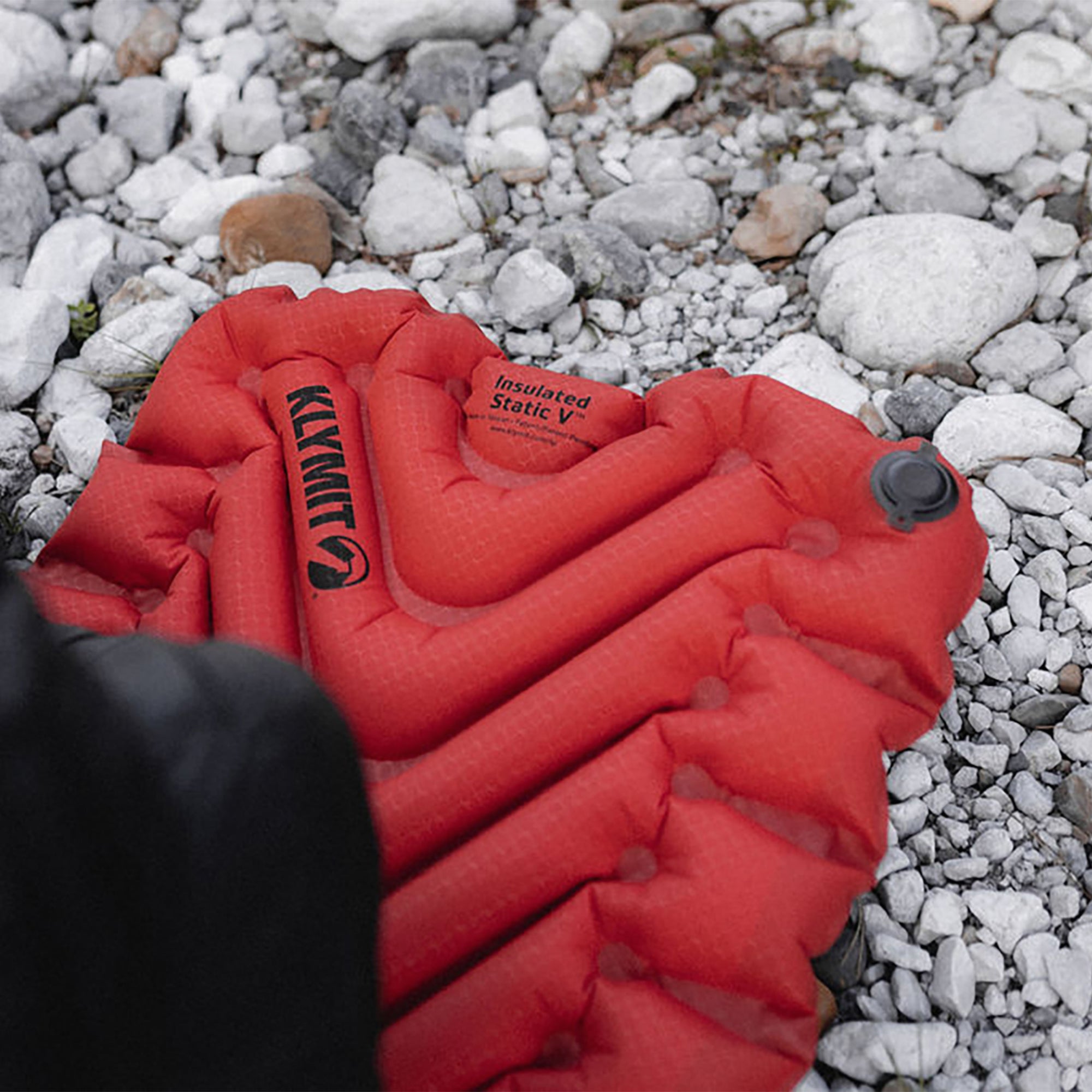 Insulated Static V Sleeping Pad, Orange, Lifestyle Pad on Rocks