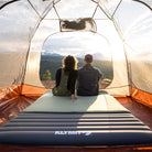 Klymaloft Sleeping Pad, Green Double, Lifestyle Couple Sitting in Tent