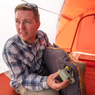 Tempest USB Pump, Green, Lifestyle Inflating a Sleeping Pad