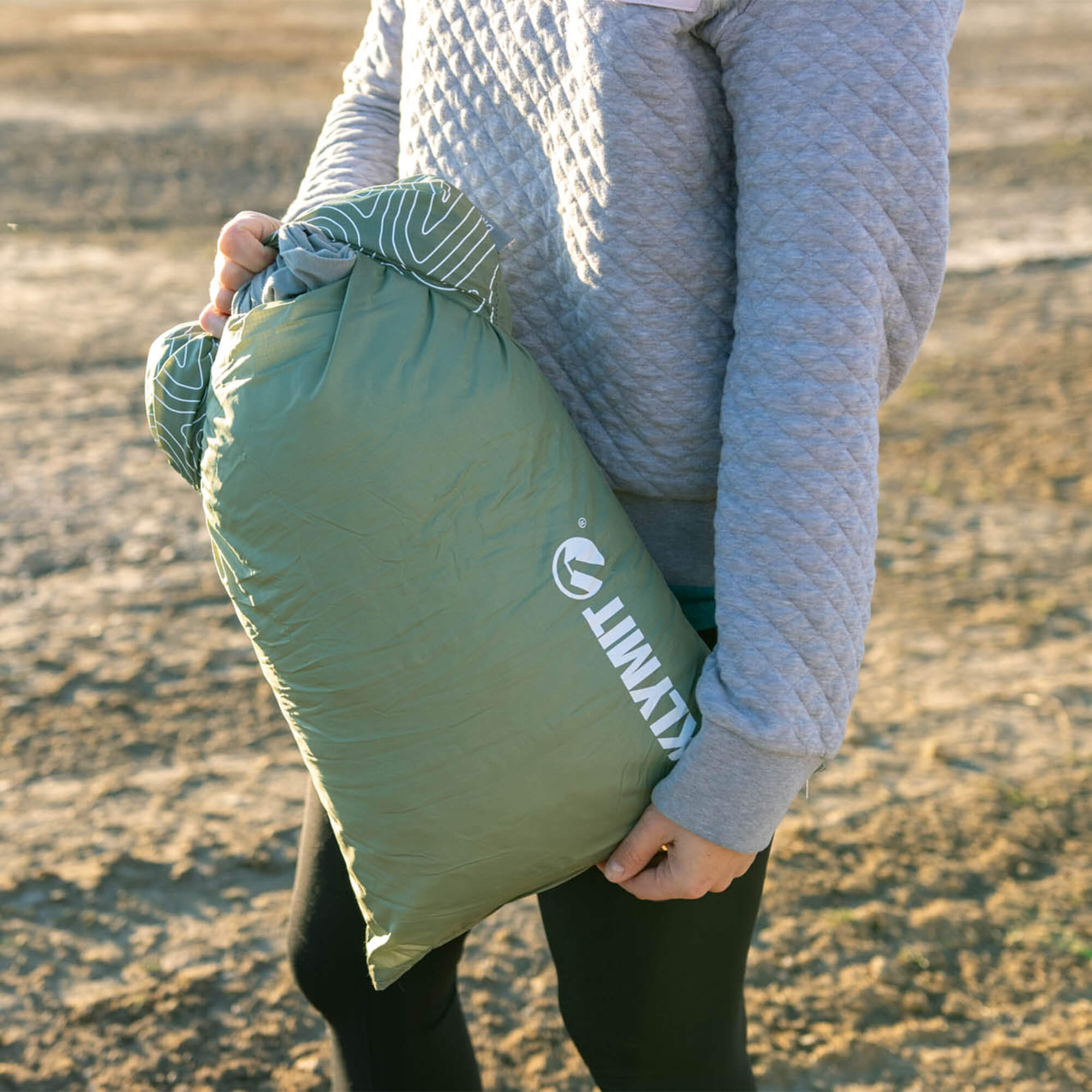 Drift Camp Pillow, Green Regular, Lifestyle Holding the Pillow