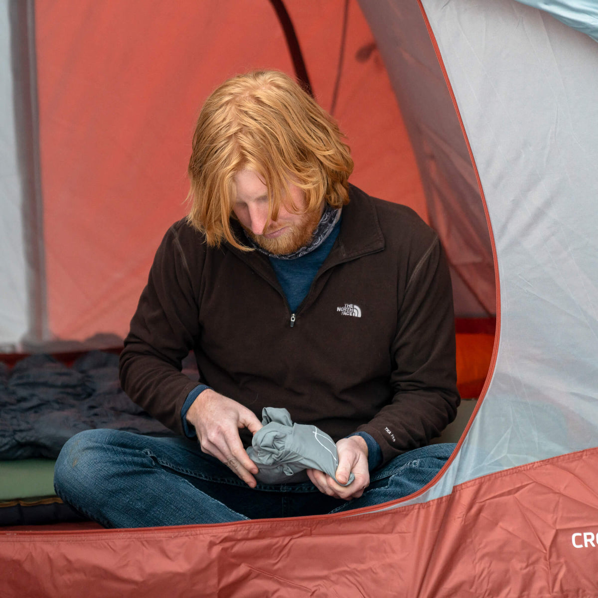 all-groups Nest Sleeping Bag Liner - Hot Weather, Gray Large, Lifestyle Man Pulling Out Liner from the Bag