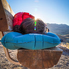 Pillow X Large, Teal, Lifestyle Woman Lying on a Bench with the Pillow