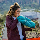 Pillow X Large, Teal, Lifestyle Woman Blowing Up the Pillow