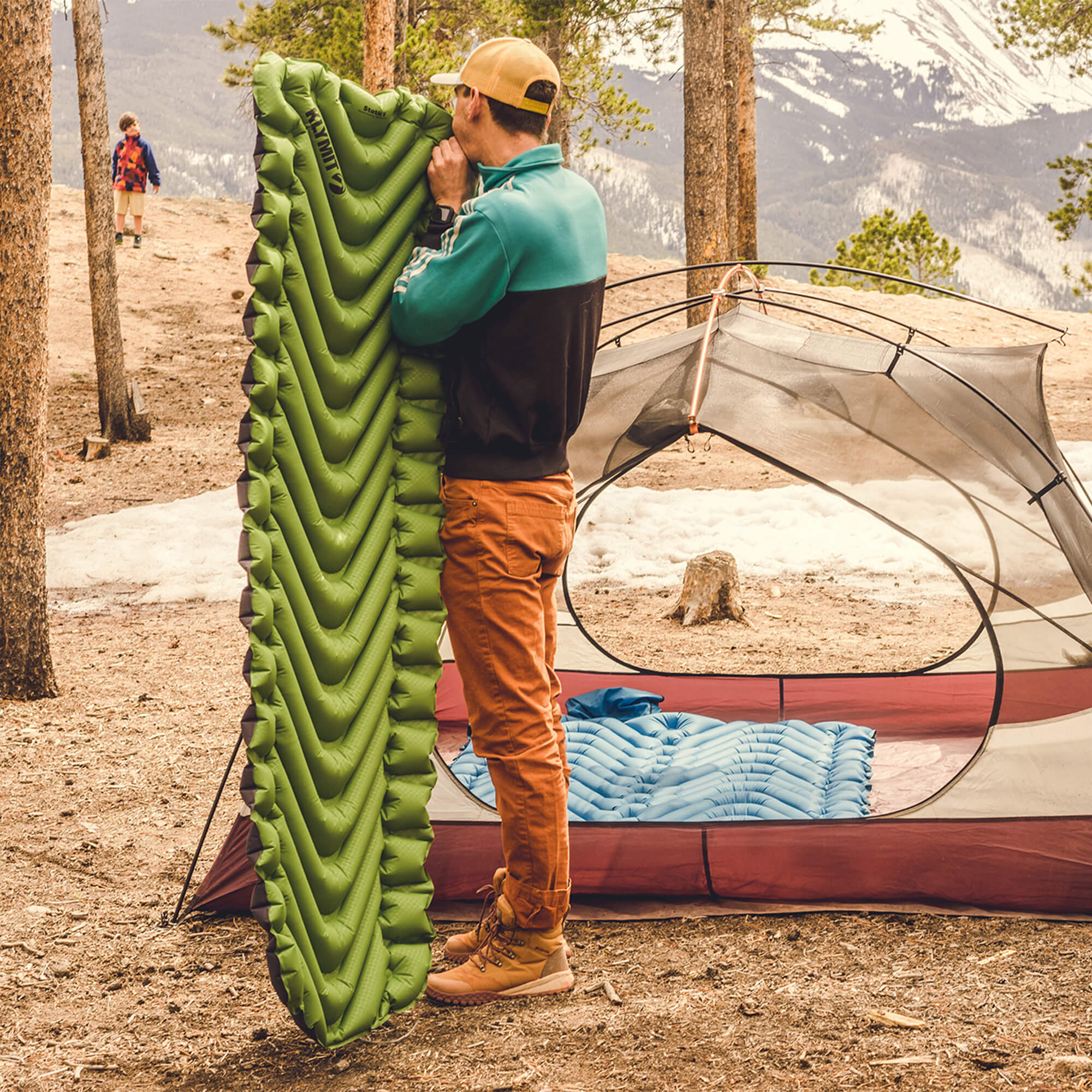 Static V Sleeping Pad, Green, Lifestyle Inflating the Pad