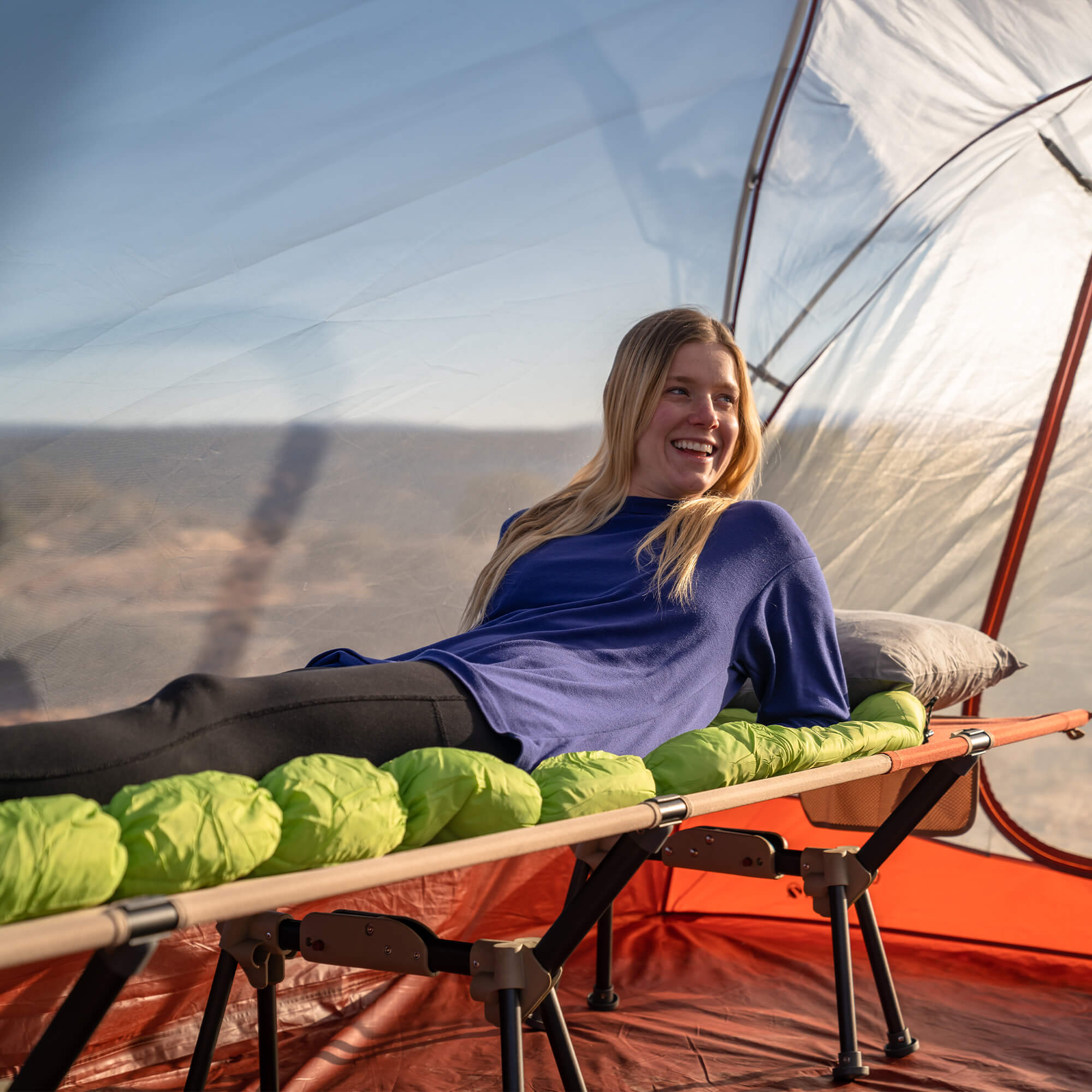 all-groups Cedar Mesa Cot, Recon/Red, Lifestyle Woman Laying on the Cot