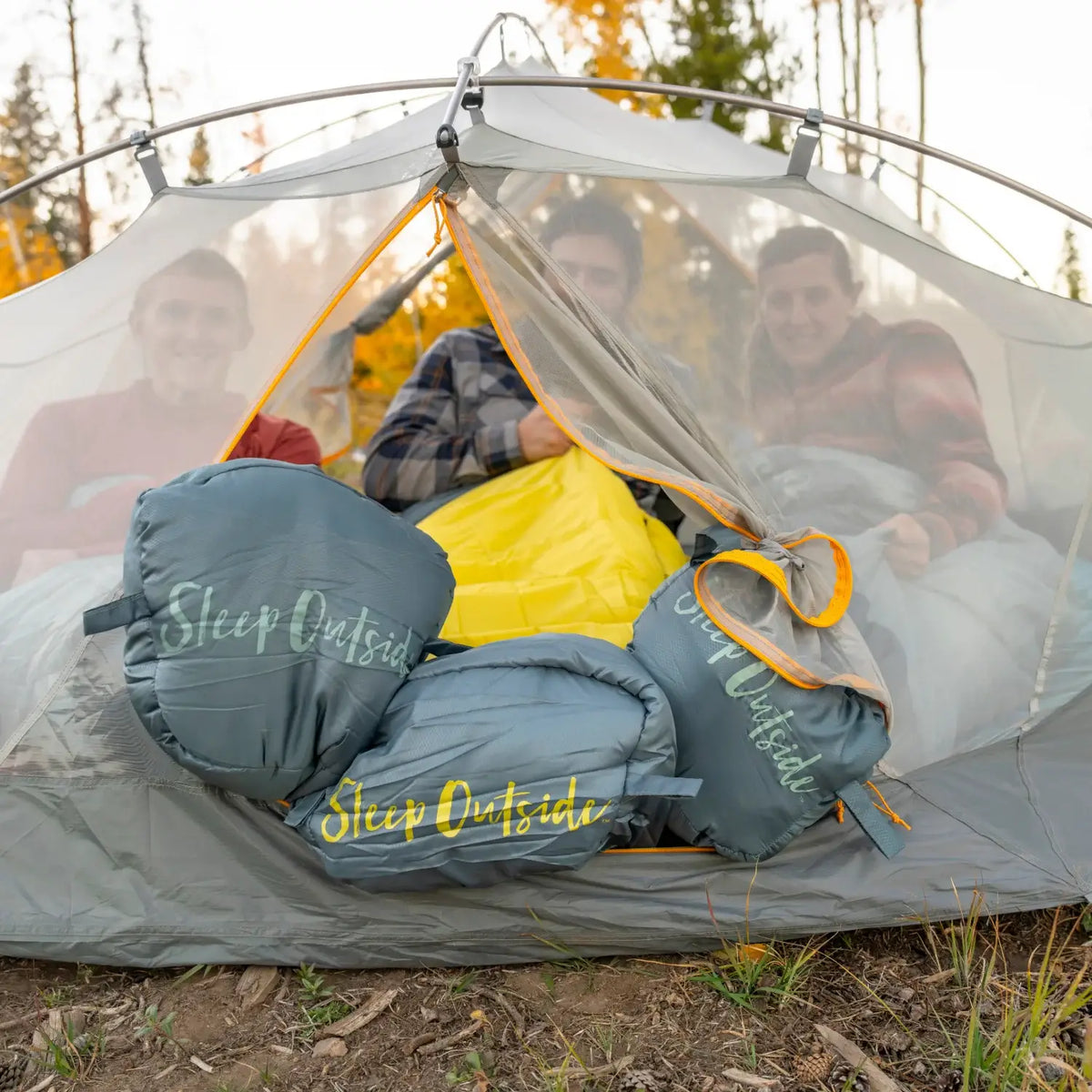 all-groups Group of campers with Klymit Wild Aspen 20 sleeping bags inside a tent.