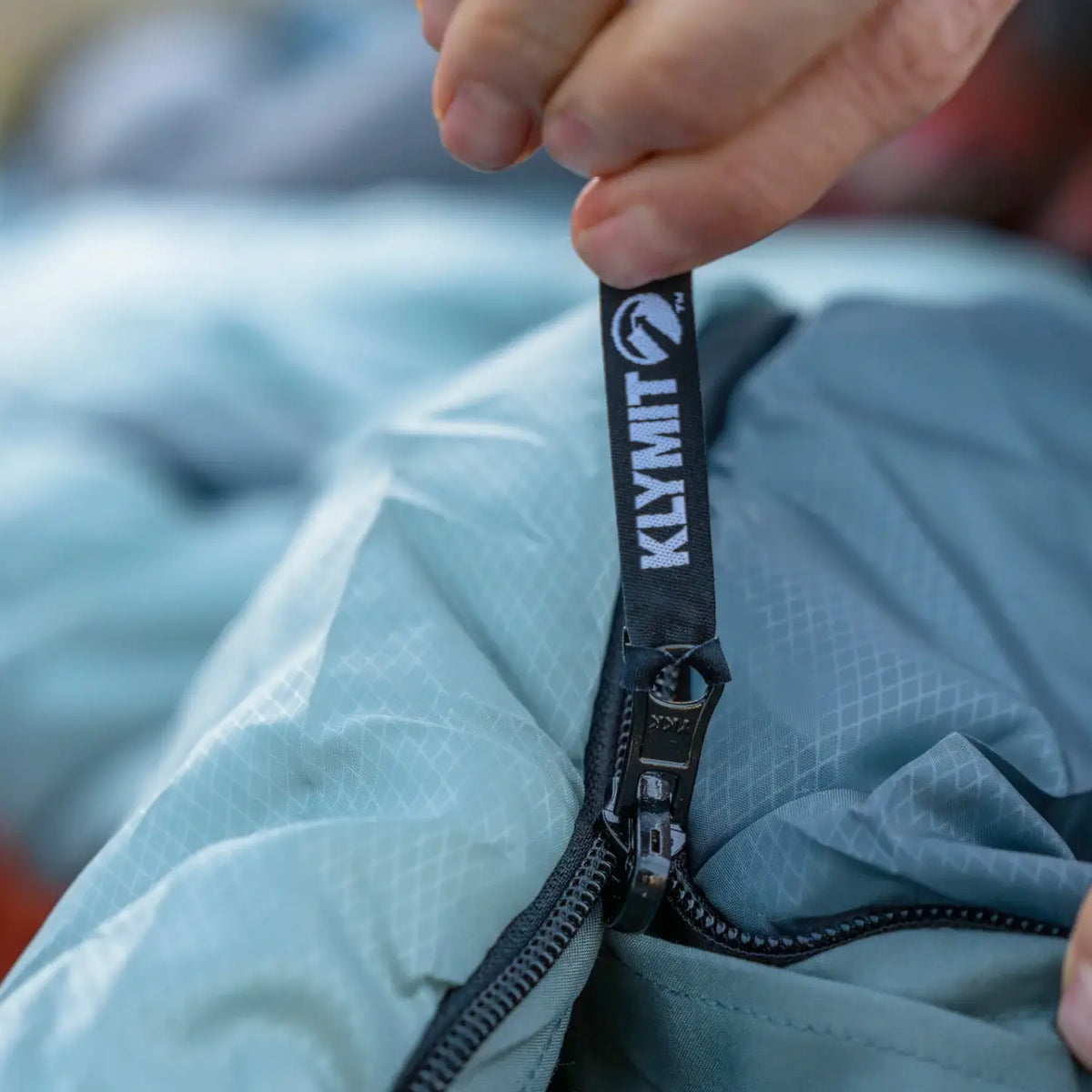 Close-up of the zipper pull on a Klymit Wild Aspen 20 Regular sleeping bag.