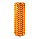 A rectangular orange inflatable Insulated Static V Lite sleeping pad with v shaped pattern shown face on.